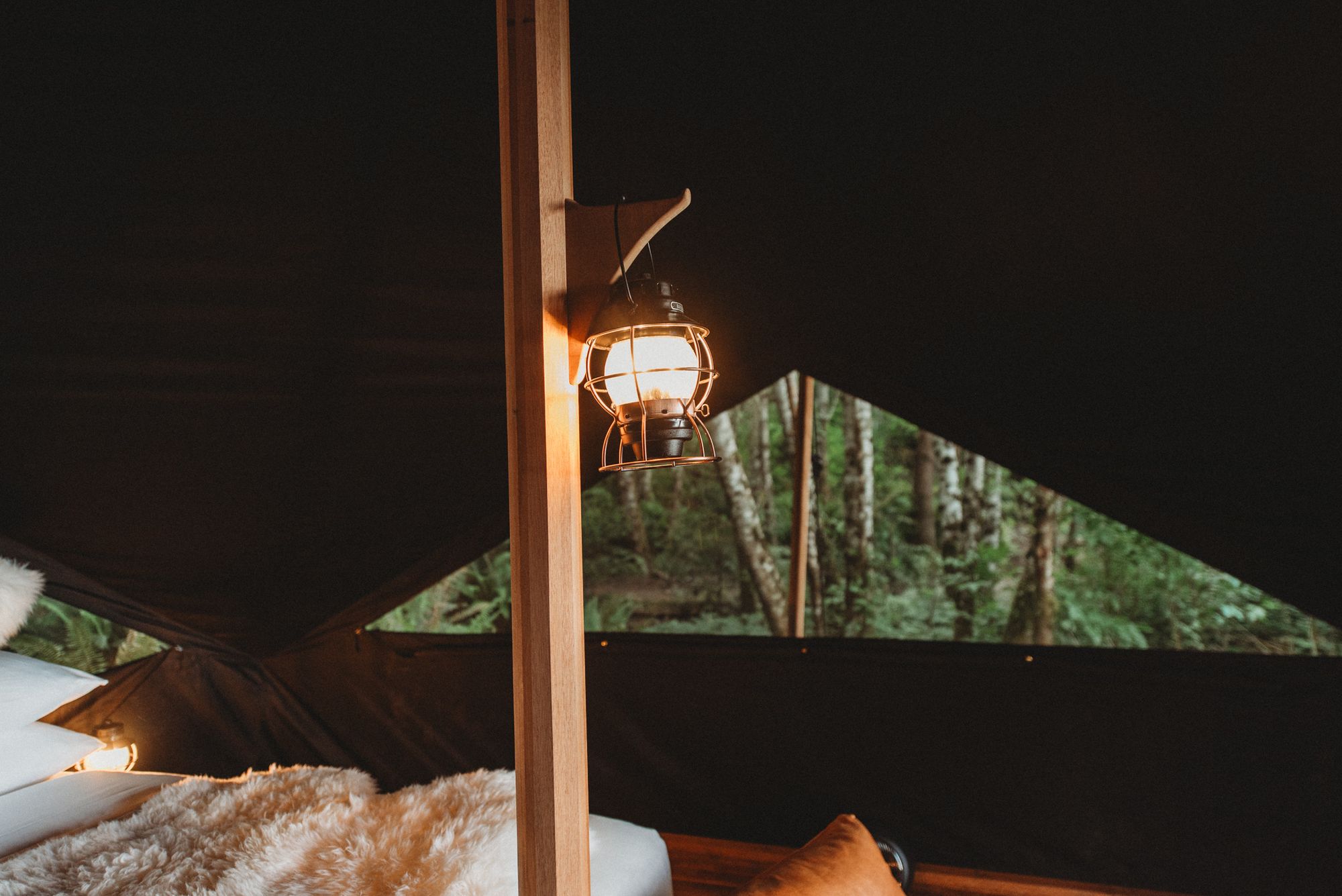 Inside the blackout tent at Menizei — low light, soft layers, the still moment of nocturne
